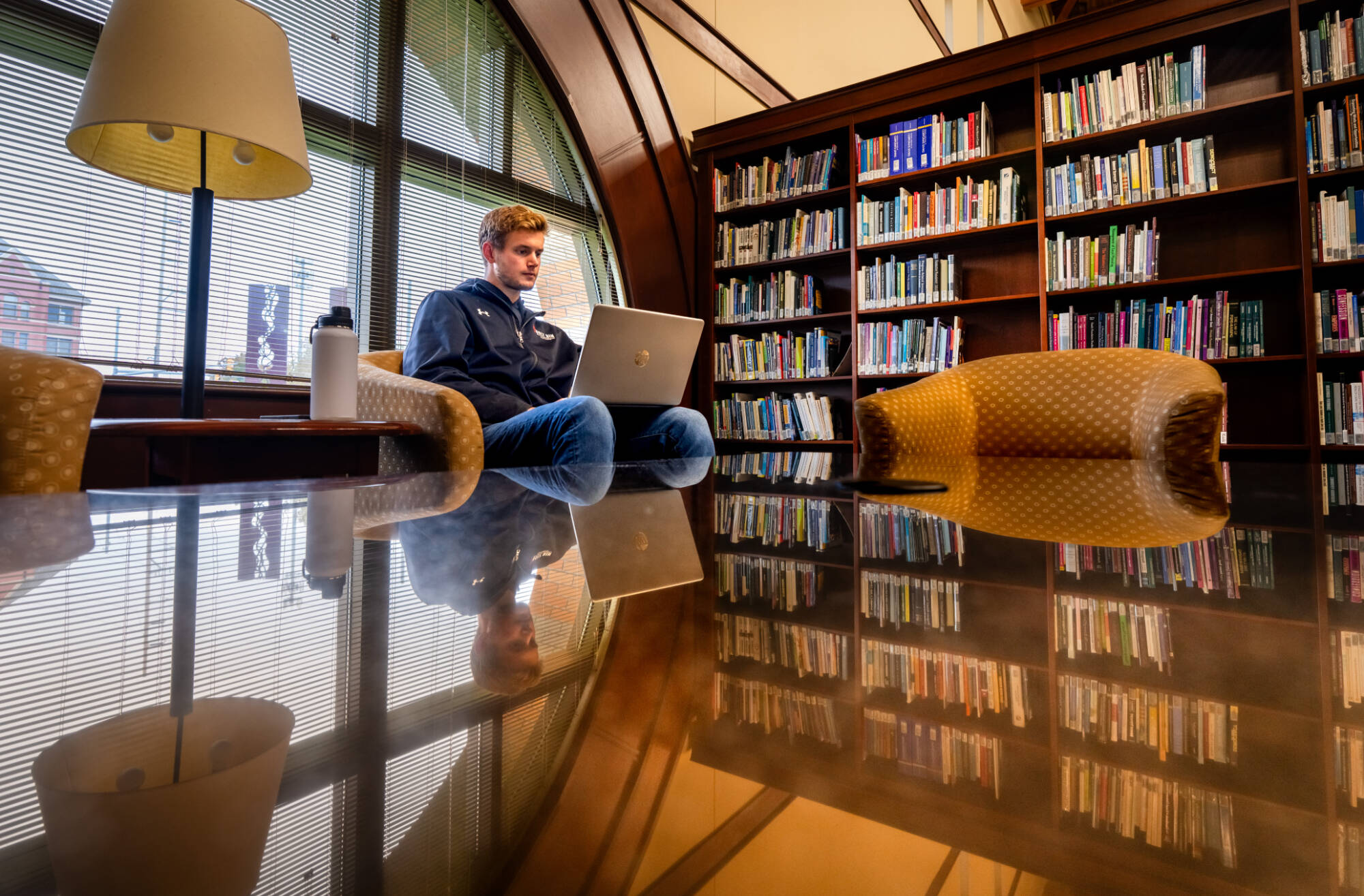 Student studying in the Steelcase library.